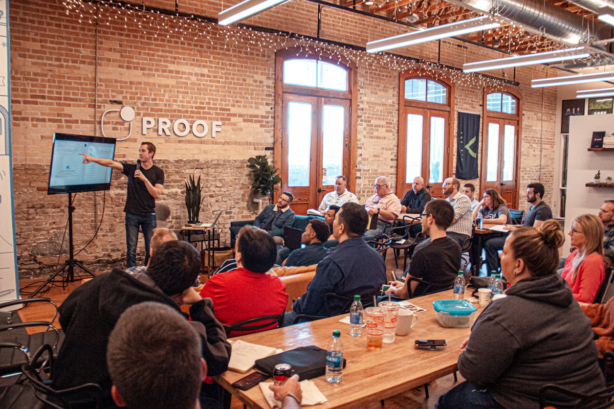 A speaker talking with a conference audience
